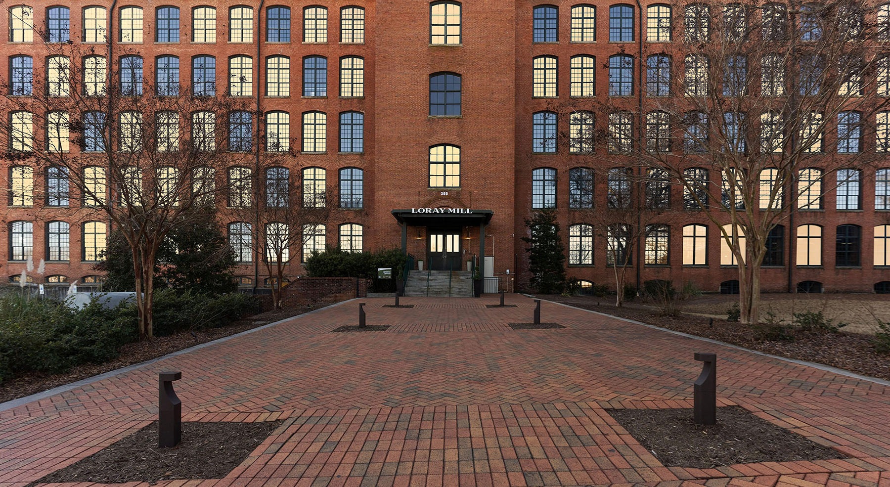 entrance to a brick building with many windows
