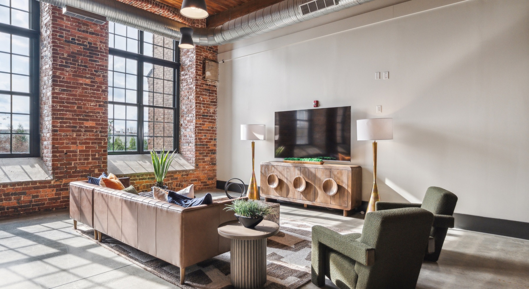 lounge area with seating tv and large windows