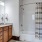 a bathroom with a shower and sink